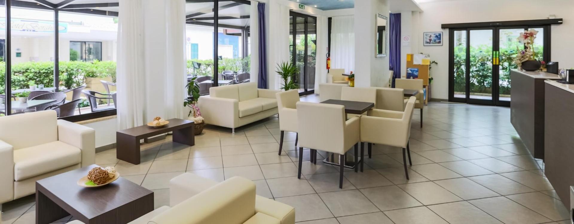 Elegant waiting room with modern furniture and natural light.